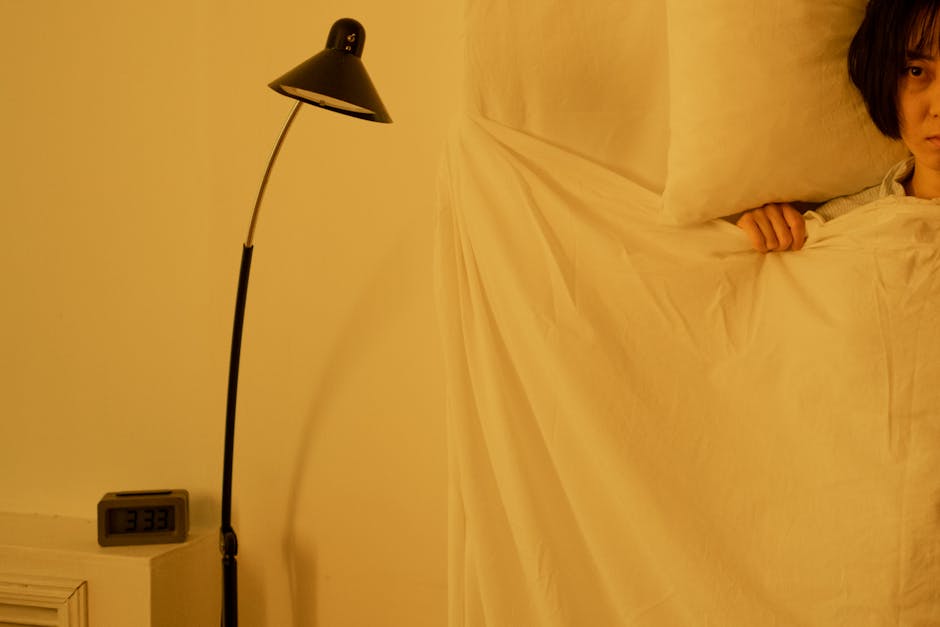 Sleeping person and bedside lamp